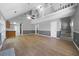 Open-concept living room with hardwood floors, fireplace, and vaulted ceilings at 30 Village Dr, Cartersville, GA 30121