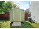 Outdoor shed in the backyard with wooden ramp and easy access for storing your lawn care and gardening equipment at 30 Village Dr, Cartersville, GA 30121