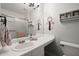Clean bathroom with a sleek vanity, framed mirror, and a glass-enclosed shower at 3065 Camden Way, Alpharetta, GA 30005
