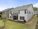 Exterior view of backyard features a covered patio and lush green lawn at 408 Cottonwood Cir, Peachtree City, GA 30269
