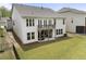Expansive backyard featuring a well-maintained lawn, deck, and patio area perfect for outdoor enjoyment at 408 Cottonwood Cir, Peachtree City, GA 30269
