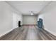 Spacious unfinished basement features gray vinyl flooring and ample room for activities at 408 Cottonwood Cir, Peachtree City, GA 30269