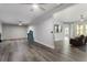 Spacious basement with vinyl flooring, ceiling fan, brick accent wall, and a rec area at 408 Cottonwood Cir, Peachtree City, GA 30269