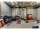 Unfinished basement featuring open wood joists and exposed brick at 408 Cottonwood Cir, Peachtree City, GA 30269