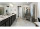 Spacious bathroom with double vanity, granite countertop, and glass shower at 408 Cottonwood Cir, Peachtree City, GA 30269