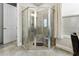 Tiled shower with glass enclosure, seating, and a window at 408 Cottonwood Cir, Peachtree City, GA 30269