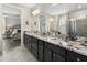 Bathroom boasts double vanity, granite counters, tile floor, and glass shower at 408 Cottonwood Cir, Peachtree City, GA 30269