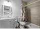 This bathroom features a shower with tiled walls, a white vanity, and a modern sink at 408 Cottonwood Cir, Peachtree City, GA 30269