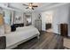 Bedroom view features a closet, bathroom, wood floors, and a tray ceiling at 408 Cottonwood Cir, Peachtree City, GA 30269