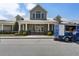 Inviting clubhouse exterior with covered entrance and a food truck at 408 Cottonwood Cir, Peachtree City, GA 30269