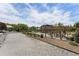 Spacious community area with gravel, outdoor seating, and verdant surroundings, perfect for hosting events and enjoying nature at 408 Cottonwood Cir, Peachtree City, GA 30269