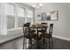 Cozy dining area featuring a round table, four chairs, and natural light from the nearby window at 408 Cottonwood Cir, Peachtree City, GA 30269