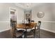 Elegant dining room with hardwood floors, a chandelier, light grey walls, and mirror at 408 Cottonwood Cir, Peachtree City, GA 30269