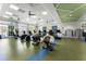 Bright fitness center with stationary bikes, weights, treadmills, large windows and fans at 408 Cottonwood Cir, Peachtree City, GA 30269