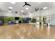 Spacious fitness center with wood flooring, workout balls, large mirrors and TV at 408 Cottonwood Cir, Peachtree City, GA 30269
