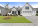 Charming home featuring a well-manicured lawn and inviting curb appeal with an attached two car garage at 408 Cottonwood Cir, Peachtree City, GA 30269
