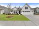 Charming home featuring a well-manicured lawn and inviting curb appeal with an attached two car garage at 408 Cottonwood Cir, Peachtree City, GA 30269