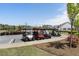 Several golf carts parked in a row with grass and trees surrounding the golf carts at 408 Cottonwood Cir, Peachtree City, GA 30269