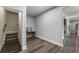 This is a bright hallway with wood-look flooring and neutral walls that create a welcoming entry at 408 Cottonwood Cir, Peachtree City, GA 30269