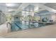 Indoor swimming pool features large windows, lounge chairs and tables at 408 Cottonwood Cir, Peachtree City, GA 30269