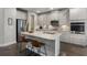 Modern kitchen with stainless steel appliances, granite countertops, and a kitchen island with seating at 408 Cottonwood Cir, Peachtree City, GA 30269
