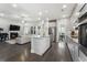 Open kitchen design with island sink, stainless appliances, and hardwood floors visible to living space at 408 Cottonwood Cir, Peachtree City, GA 30269