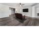 Living room features wood-look flooring, neutral walls, and ceiling fan at 408 Cottonwood Cir, Peachtree City, GA 30269