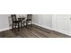 Neutral room with gray laminate flooring, bright white door, and elegant chairs at 408 Cottonwood Cir, Peachtree City, GA 30269