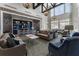 Well-appointed lounge featuring comfortable sofas, stylish lighting, and exposed brick at 408 Cottonwood Cir, Peachtree City, GA 30269