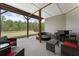 Outdoor patio with elegant wicker furniture with a beautiful view of the trees at 408 Cottonwood Cir, Peachtree City, GA 30269