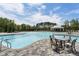 Stunning community pool featuring a large swimming area, comfortable seating, and beautiful landscaping, perfect for relaxation at 408 Cottonwood Cir, Peachtree City, GA 30269