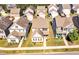 Aerial view showcasing several homes in a community with manicured lawns and tree-lined streets at 637 Sunflower Dr, Canton, GA 30114