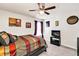 Comfortable bedroom with a ceiling fan, natural light, and stylish decor at 637 Sunflower Dr, Canton, GA 30114
