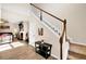 Inviting entryway with staircase leading to living area, wood laminate flooring, and natural lighting at 637 Sunflower Dr, Canton, GA 30114