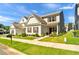 Beautiful home with manicured lawn and charming front porch at 637 Sunflower Dr, Canton, GA 30114