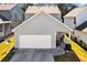 The home features a clean garage and small porch area with views to well-maintained landscaping at 637 Sunflower Dr, Canton, GA 30114