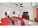Spacious main bedroom with a ceiling fan, tray ceiling, and adjacent closet and ensuite bath at 637 Sunflower Dr, Canton, GA 30114