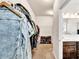 Large walk-in closet leading to a bathroom with double sinks at 637 Sunflower Dr, Canton, GA 30114