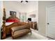 Bedroom featuring a four poster bed with dresser and graffiti decor at 640 Parkside Place Dr, Mcdonough, GA 30253