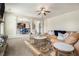 A living room with neutral paint, an area rug, and multiple sofas and tables at 640 Parkside Place Dr, Mcdonough, GA 30253