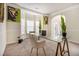 Bright home office with a glass-top desk, neutral decor, and ample natural light creates a calm and productive environment at 640 Parkside Place Dr, Mcdonough, GA 30253