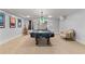 Spacious basement with pool table, comfortable armchair, and stylish lighting fixtures at 519 River Estates Pkwy, Canton, GA 30115