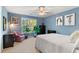 Cozy bedroom featuring a large window, decor, and furnishings for relaxation at 519 River Estates Pkwy, Canton, GA 30115