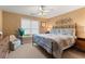 Inviting bedroom with neutral paint, window, and metal frame bed at 519 River Estates Pkwy, Canton, GA 30115