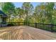 Spacious wood deck with decorative black metal railing and beautiful views at 519 River Estates Pkwy, Canton, GA 30115