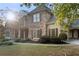 Charming two-story home with stone facade, lush landscaping, and manicured lawn at 519 River Estates Pkwy, Canton, GA 30115