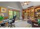 Spacious home office with custom wood built-ins, vaulted ceiling, and lots of natural light at 519 River Estates Pkwy, Canton, GA 30115
