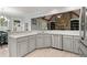 Open kitchen with white cabinets, granite countertops, and stainless steel appliances at 519 River Estates Pkwy, Canton, GA 30115