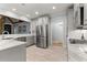 Bright kitchen featuring stainless appliances, white countertops, and gray cabinets at 519 River Estates Pkwy, Canton, GA 30115