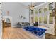 Bright living room with a wall of windows and a stone fireplace at 519 River Estates Pkwy, Canton, GA 30115